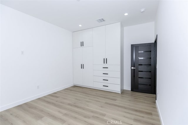 15009 Wyandotte St, Van Nuys, CA 91405 - unfurnished bedroom with light wood finished floors, recessed lighting, and a closet