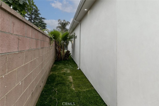 15009 Wyandotte St, Van Nuys, CA 91405 - view of side of home featuring stucco siding