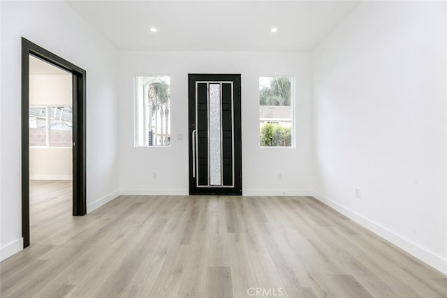 15009 Wyandotte St, Van Nuys, CA 91405 - foyer with light wood-style flooring, healthy amount of natural light, and recessed lighting