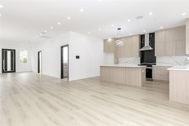 15009 Wyandotte St, Van Nuys, CA 91405 - kitchen featuring modern cabinets, light brown cabinets, open floor plan, range with gas cooktop, and recessed lighting