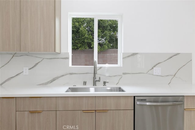 15009 Wyandotte St, Van Nuys, CA 91405 - kitchen featuring stainless steel dishwasher, light brown cabinetry, light countertops, and backsplash