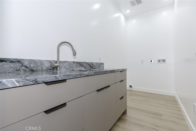 15009 Wyandotte St, Van Nuys, CA 91405 - kitchen with white cabinetry, recessed lighting, modern cabinets, and light wood-type flooring
