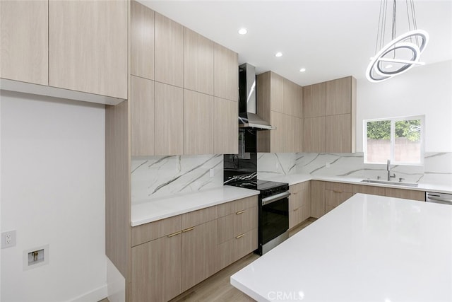 15009 Wyandotte St, Van Nuys, CA 91405 - kitchen featuring modern cabinets, light brown cabinetry, wall chimney range hood, and recessed lighting