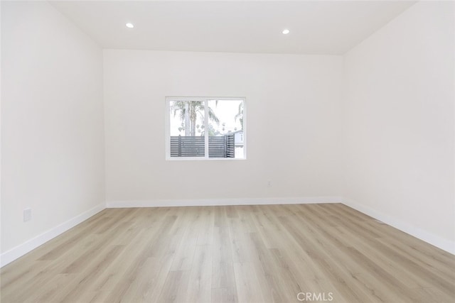 15009 Wyandotte St, Van Nuys, CA 91405 - empty room featuring light wood-type flooring and recessed lighting