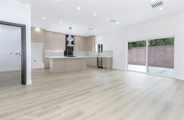 15009 Wyandotte St, Van Nuys, CA 91405 - unfurnished living room featuring recessed lighting and light wood-type flooring