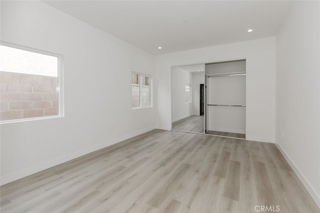 15009 Wyandotte St, Van Nuys, CA 91405 - unfurnished bedroom with light wood-style floors, multiple windows, a closet, and recessed lighting