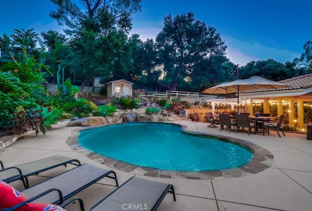 9733 Kentland Ave, Chatsworth, CA 91311 - outdoor pool with a storage unit and a patio