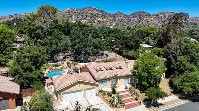 9733 Kentland Ave, Chatsworth, CA 91311 - view of subject property featuring a mountain backdrop and a pool