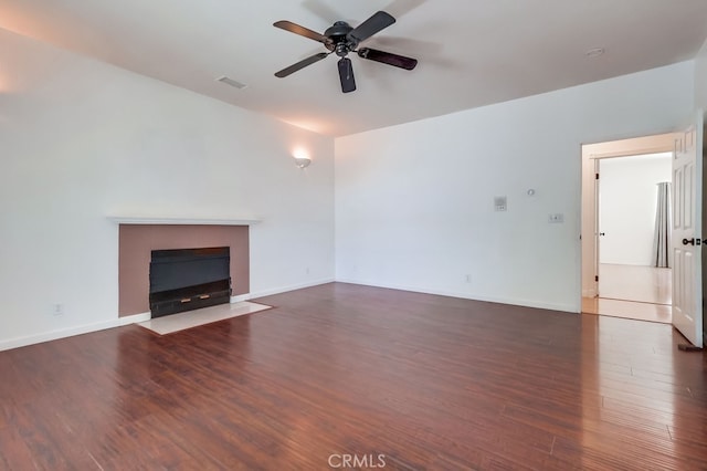9733 Kentland Ave, Chatsworth, CA 91311 - unfurnished living room with wood finished floors, a ceiling fan, and a fireplace with flush hearth