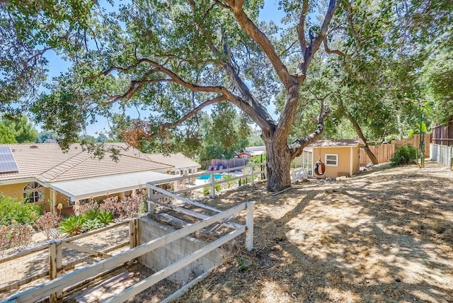 9733 Kentland Ave, Chatsworth, CA 91311 - fenced backyard featuring a storage unit