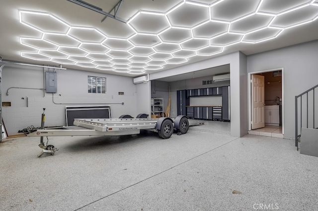 9733 Kentland Ave, Chatsworth, CA 91311 - garage featuring a wall mounted air conditioner and electric panel
