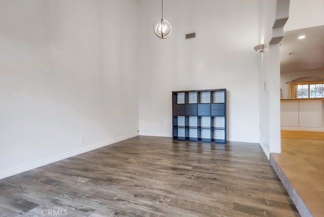 9733 Kentland Ave, Chatsworth, CA 91311 - unfurnished living room with a high ceiling and wood finished floors