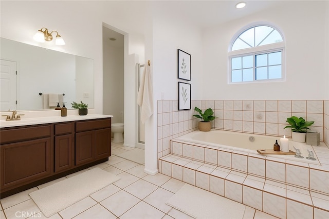 9733 Kentland Ave, Chatsworth, CA 91311 - full bath featuring vanity, a garden tub, and tile patterned floors