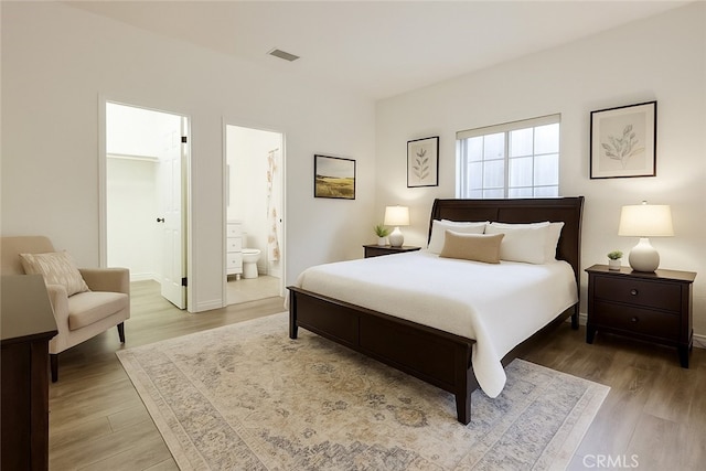 9733 Kentland Ave, Chatsworth, CA 91311 - bedroom with wood finished floors and connected bathroom