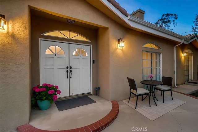 9733 Kentland Ave, Chatsworth, CA 91311 - property entrance featuring stucco siding and a patio
