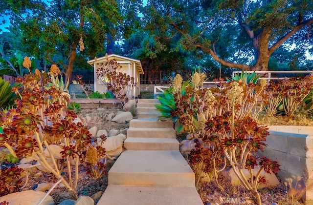 9733 Kentland Ave, Chatsworth, CA 91311 - view of yard featuring a shed and stairway