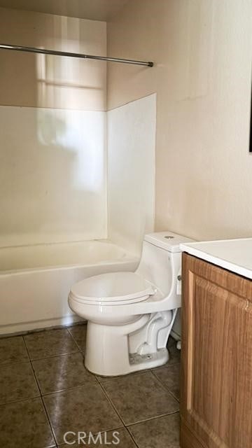 1735 E Washington St, Colton, CA 92324 - bathroom with tile patterned floors, washtub / shower combination, and vanity