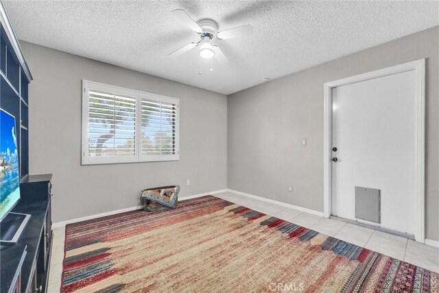 25270 Tradewinds Dr, Menifee, CA 92585 - unfurnished room with a ceiling fan, a textured ceiling, and light tile patterned flooring