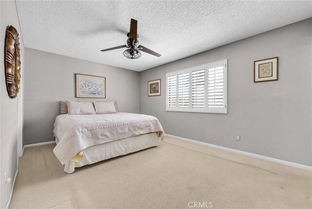 25270 Tradewinds Dr, Menifee, CA 92585 - bedroom with carpet flooring, a textured ceiling, and a ceiling fan
