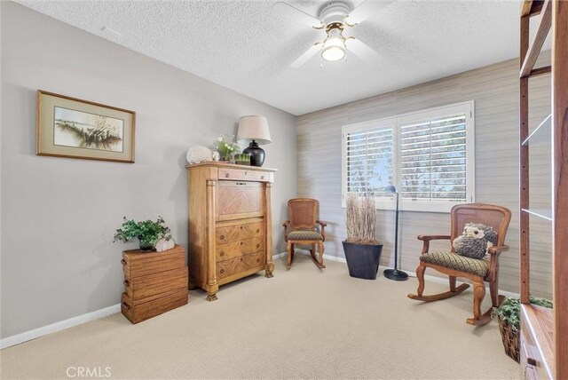 25270 Tradewinds Dr, Menifee, CA 92585 - sitting room featuring carpet floors, a textured ceiling, and a ceiling fan