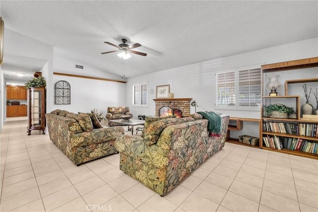 25270 Tradewinds Dr, Menifee, CA 92585 - living area featuring a ceiling fan, light tile patterned floors, lofted ceiling, a textured ceiling, and a brick fireplace