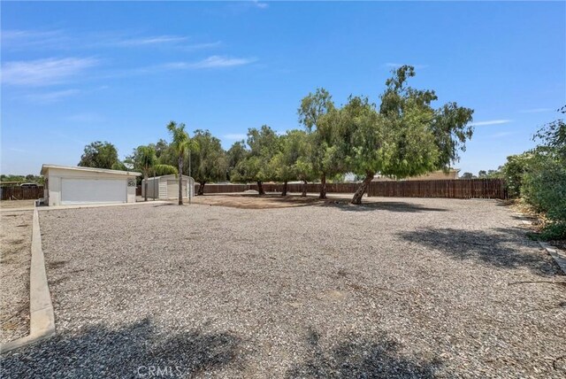 25270 Tradewinds Dr, Menifee, CA 92585 - view of yard with an outdoor structure