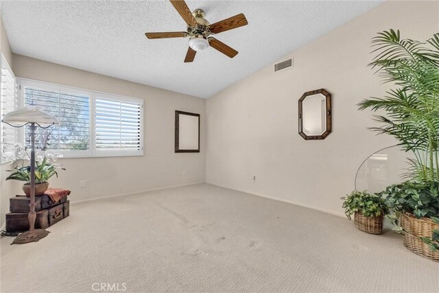 25270 Tradewinds Dr, Menifee, CA 92585 - unfurnished room featuring a ceiling fan, carpet flooring, a textured ceiling, and lofted ceiling