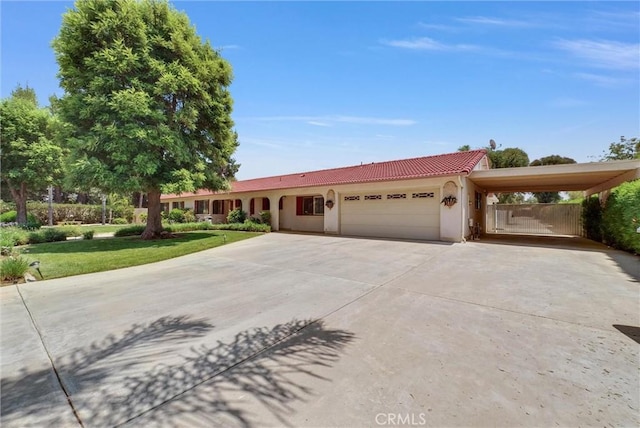 25270 Tradewinds Dr, Menifee, CA 92585 - single story home with a garage, driveway, a tile roof, stucco siding, and an attached carport