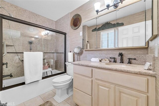 25270 Tradewinds Dr, Menifee, CA 92585 - full bath featuring tile patterned floors, bath / shower combo with glass door, and vanity