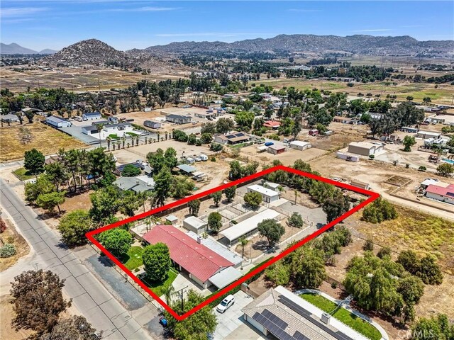 25270 Tradewinds Dr, Menifee, CA 92585 - aerial view of property and surrounding area with a mountain backdrop and property boundaries highlighted