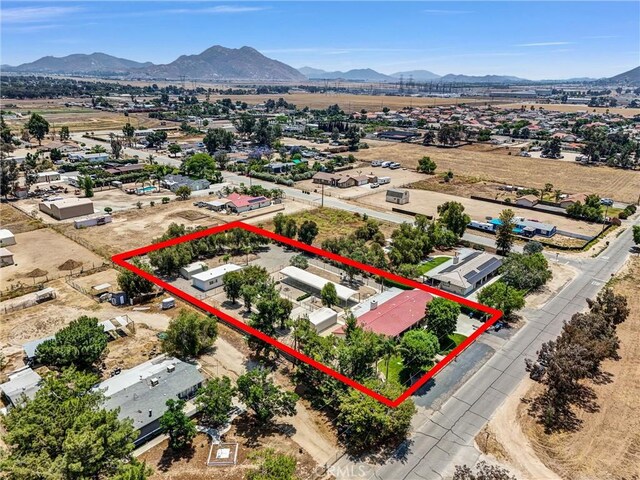 25270 Tradewinds Dr, Menifee, CA 92585 - aerial view of property and surrounding area with a mountain backdrop and property boundaries highlighted