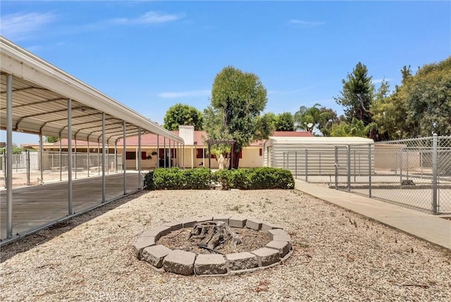 25270 Tradewinds Dr, Menifee, CA 92585 - view of yard featuring an outdoor fire pit