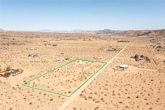 2250 Delgada Ave, Landers, CA 92285 - aerial view of sparsely populated area featuring a mountainous background and property boundaries highlighted