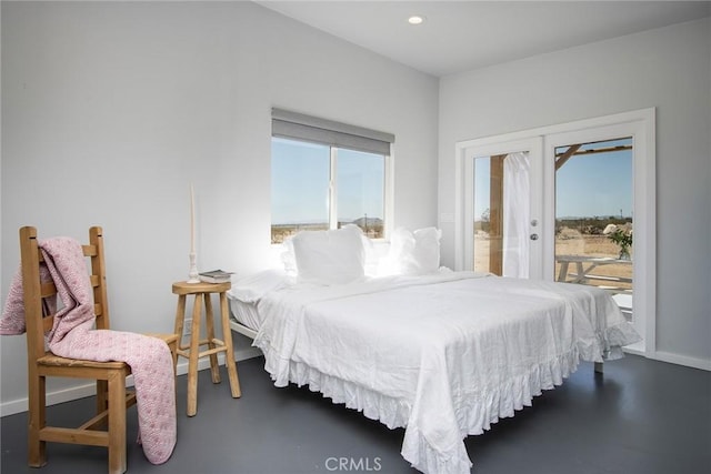 2250 Delgada Ave, Landers, CA 92285 - bedroom featuring access to exterior, finished concrete floors, and recessed lighting