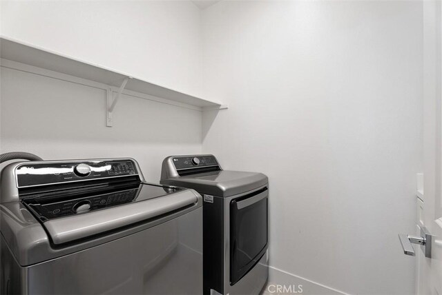 12178 Greenleaf Ln, Garden Grove, CA 92840 - laundry area with washer and clothes dryer