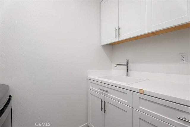 12178 Greenleaf Ln, Garden Grove, CA 92840 - washroom featuring a sink and baseboards