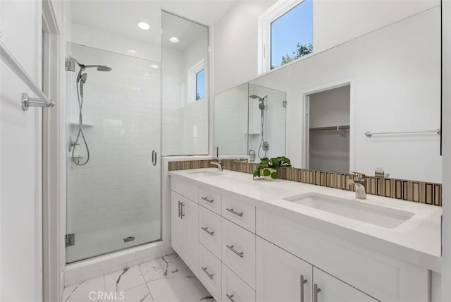 12178 Greenleaf Ln, Garden Grove, CA 92840 - bathroom featuring marble look tile flooring, a stall shower, double vanity, recessed lighting, and a spacious closet