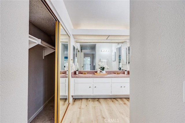42768 Santa Suzanne Pl, Temecula, CA 92592 - bathroom featuring double vanity and a textured wall