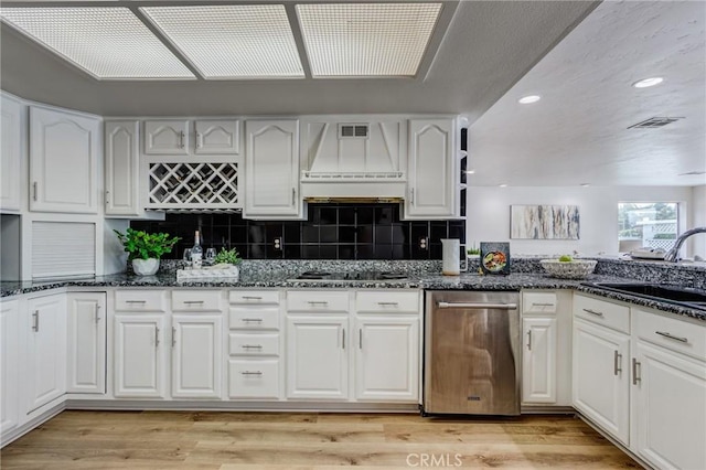 42768 Santa Suzanne Pl, Temecula, CA 92592 - kitchen featuring dark stone counters, white cabinetry, light wood finished floors, tasteful backsplash, and recessed lighting