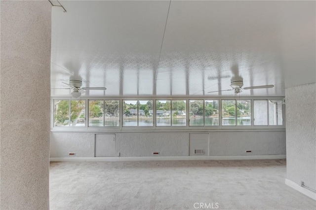 42768 Santa Suzanne Pl, Temecula, CA 92592 - spare room featuring ceiling fan, carpet floors, healthy amount of natural light, and a textured wall
