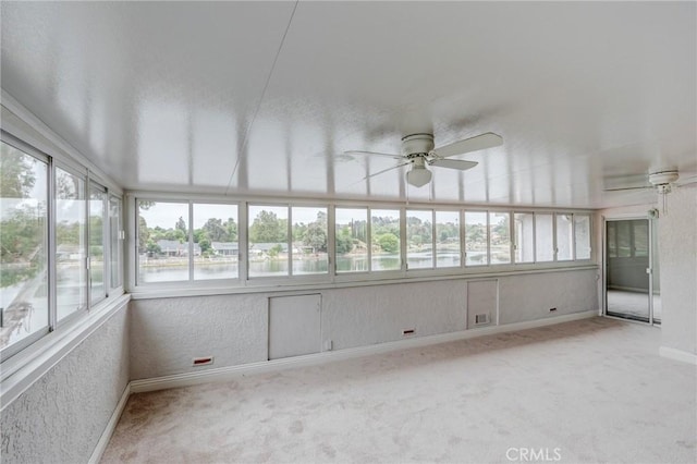 42768 Santa Suzanne Pl, Temecula, CA 92592 - unfurnished sunroom featuring plenty of natural light, a ceiling fan, carpet floors, and a textured wall