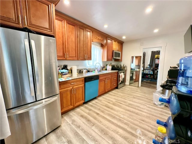 3238 Prospect Ave, La Crescenta, CA 91214 - kitchen with stainless steel appliances, light countertops, light wood-type flooring, brown cabinetry, and recessed lighting