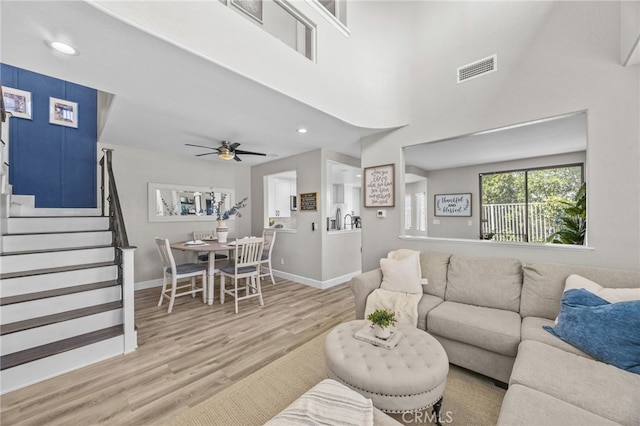 1519 San Rafael Pl, Corona, CA 92882 - living room featuring light wood-type flooring, stairs, ceiling fan, and recessed lighting