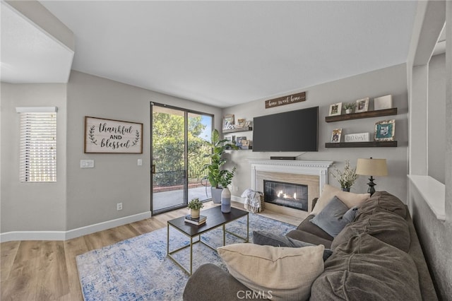 1519 San Rafael Pl, Corona, CA 92882 - living room featuring light wood-style flooring and a glass covered fireplace