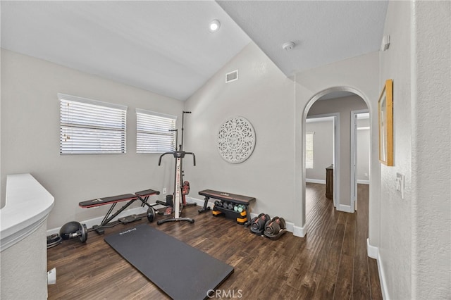 1519 San Rafael Pl, Corona, CA 92882 - workout area featuring lofted ceiling, arched walkways, and wood finished floors