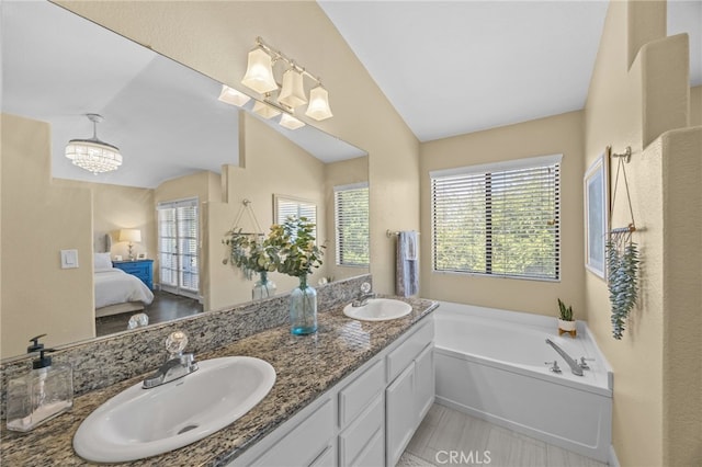 1519 San Rafael Pl, Corona, CA 92882 - ensuite bathroom with vaulted ceiling, double vanity, plenty of natural light, a bath, and a chandelier