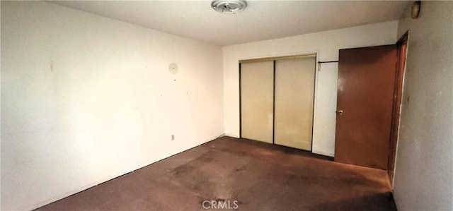 14805 Chase St Unit 105, Panorama City, CA 91402 - unfurnished bedroom featuring dark carpet and a closet