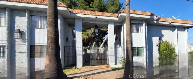 14805 Chase St Unit 105, Panorama City, CA 91402 - view of property exterior featuring a tiled roof and stucco siding