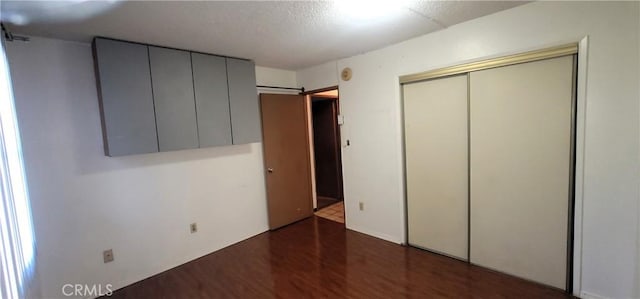 14805 Chase St Unit 105, Panorama City, CA 91402 - unfurnished bedroom featuring wood finished floors and a closet