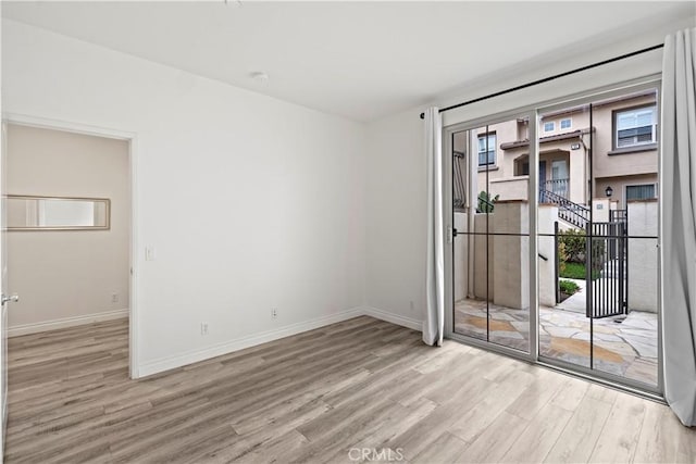 80 Hedge Bloom, Irvine, CA 92618 - spare room featuring wood finished floors and baseboards